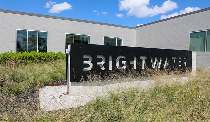 Cinderblock building with sign that says Brightwater