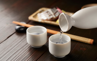 Japanese sake pouring in ceramic cup